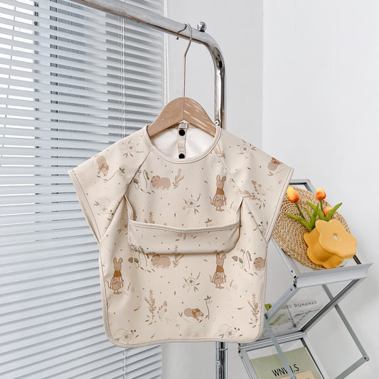 Śliniak z kieszonką w drobne wzorki Śliniak z kieszonką w drobne wzorki