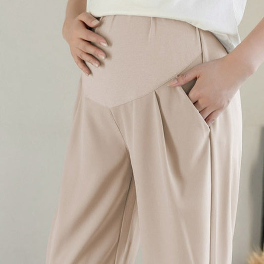 Spodnie ciążowe z gumką w pasie w jasnych kolorach Spodnie ciążowe z gumką w pasie w jasnych kolorach