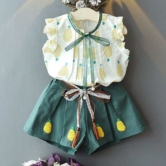 Śliczny dziewczęcy komplet z kokardką i wzorem w ananasy